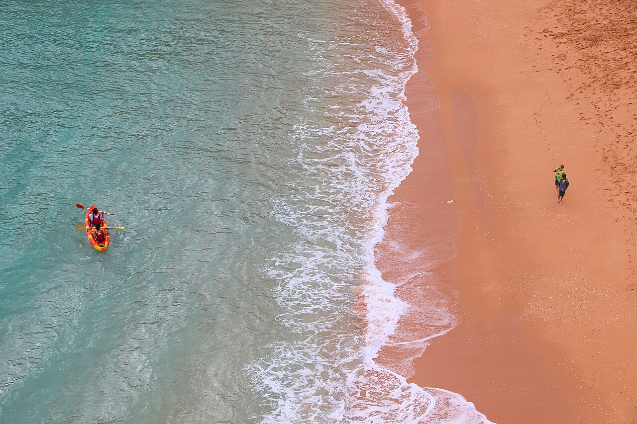 A two-person sea kayak on the Atlantic surf